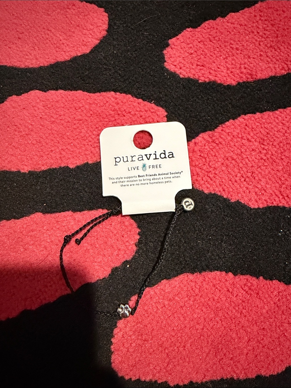 Pura Vida black bracelet with dog paw charm